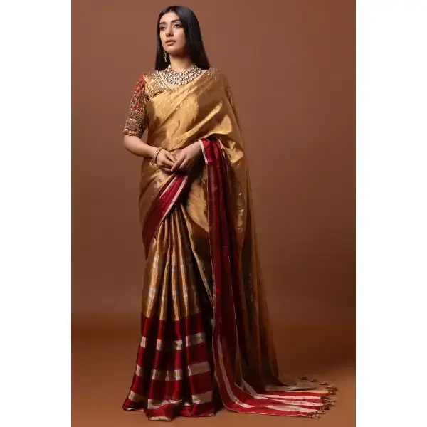 SEASONS-GOLD AND RED CLASSIC SAREE SET PAIRED WITH A MATCHING HAND EMBROIDERED BLOUSE AND MIRROR DETAILS.